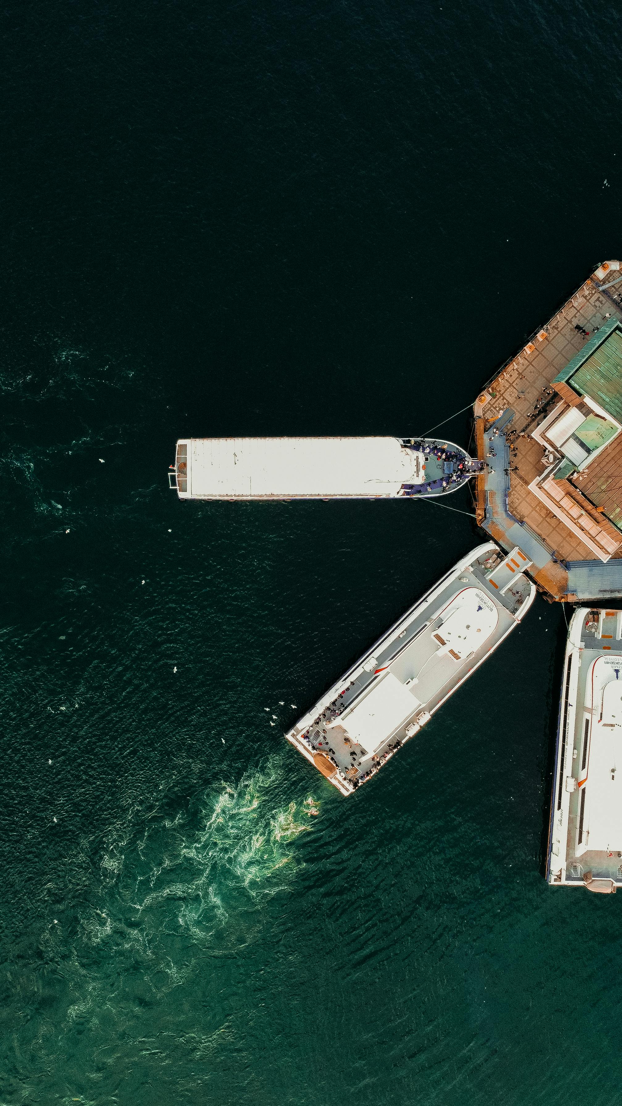 Aerial view of ferries docking at a port terminal